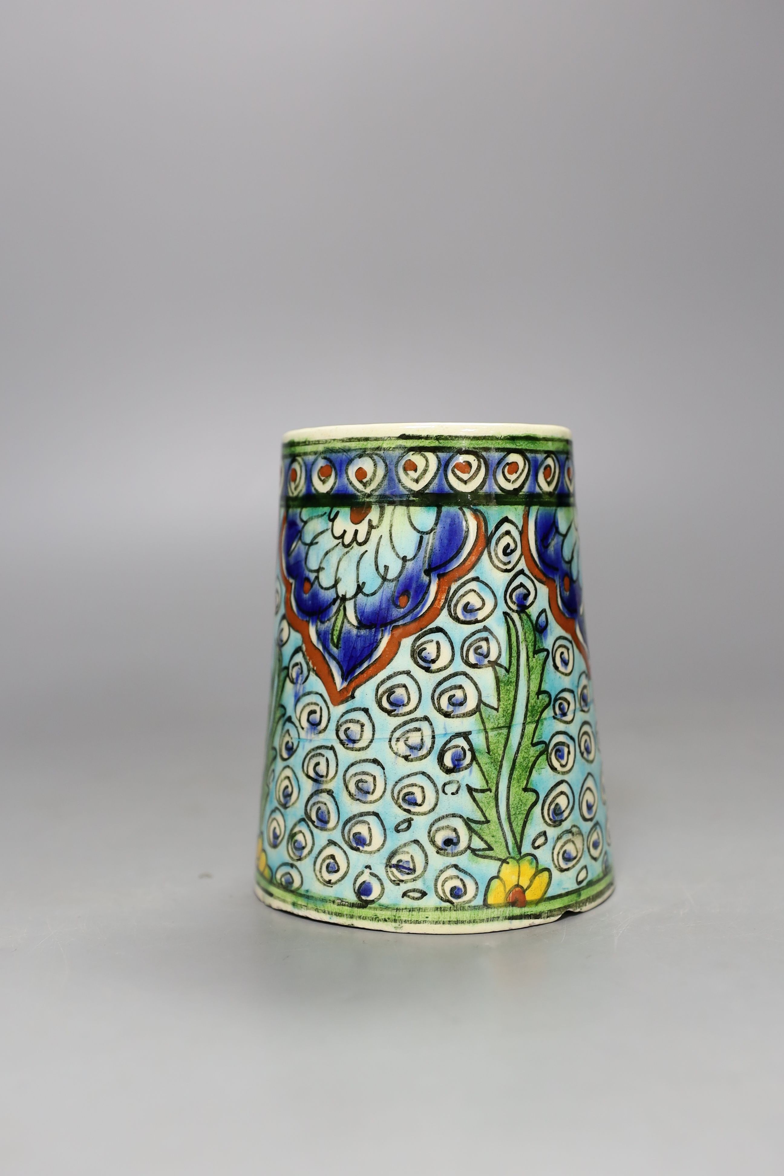 A Turkish Kutahya earthenware tapering mug, 12.5 cm high